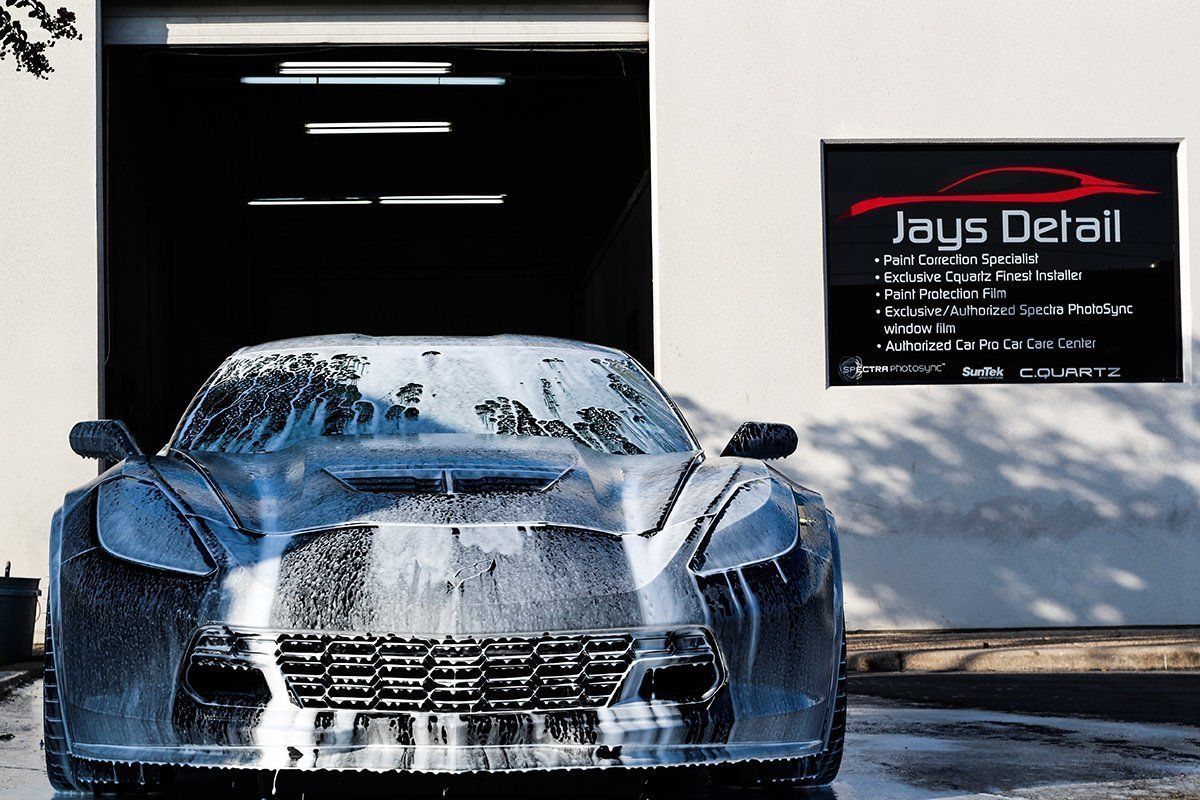 Car covered in soap suds at Jays Detail car wash.