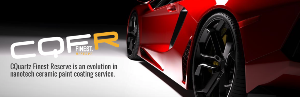 Red sports car with black rims and gold accents. 