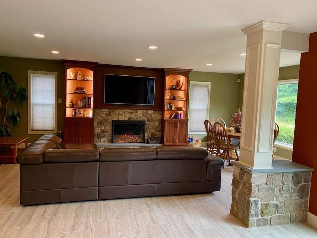 Basement Living Room — Modern Fireplace With Brick Wall in Lan ghorne, PA