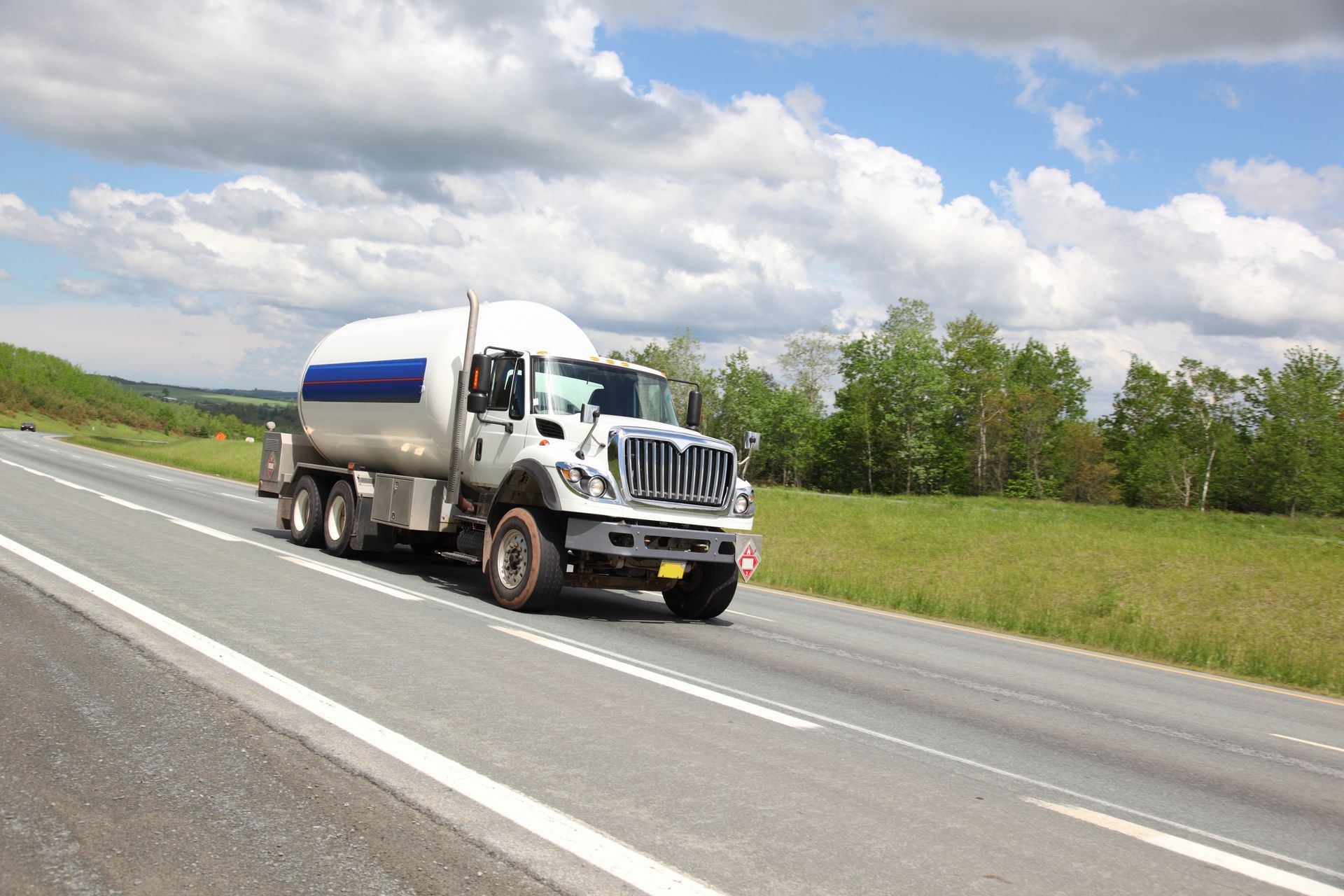 A propane delivery truck heads out, ready to keep your home or business supplied.