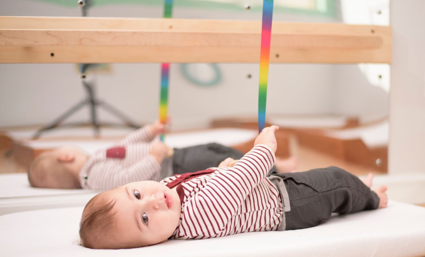 Montessori infant laying down in the classroom