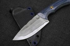 A small fixed-blade knife with a textured blade, blue handle, and black leather sheath.