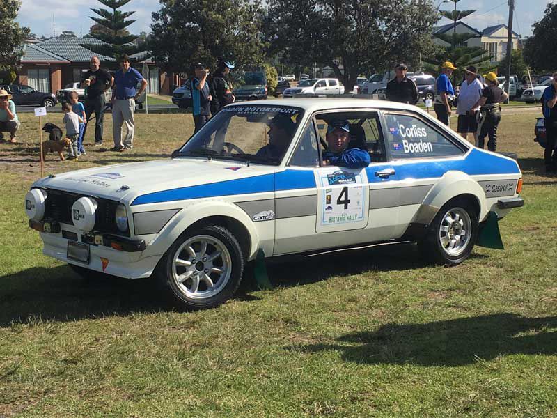 A Blue and White Car on the Side is Parked in a Grassy Field — Hastings River Brake & Exhaust in Port Macquarie, NSW