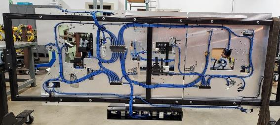 Electrical panel with blue wires and black frame.