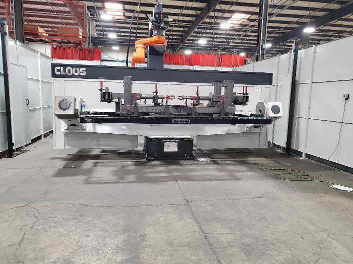 Large industrial welding robot in a factory, with