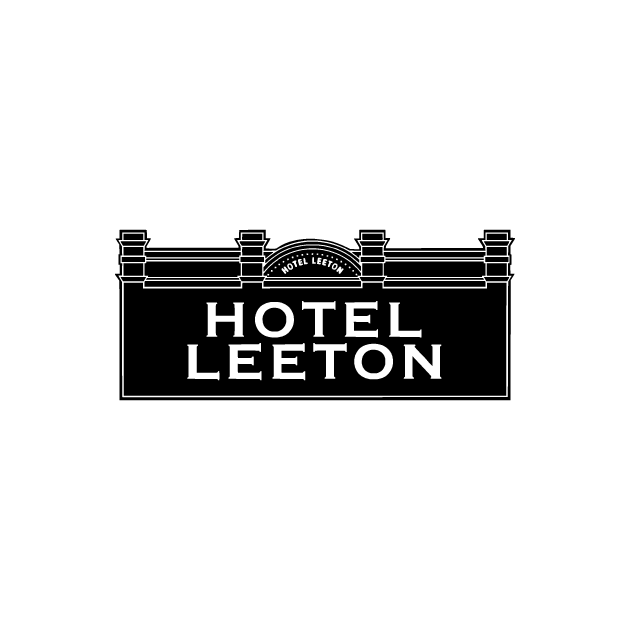 Hotel Leeton sign with white text on a black rectangle, topped with a decorative architectural design.