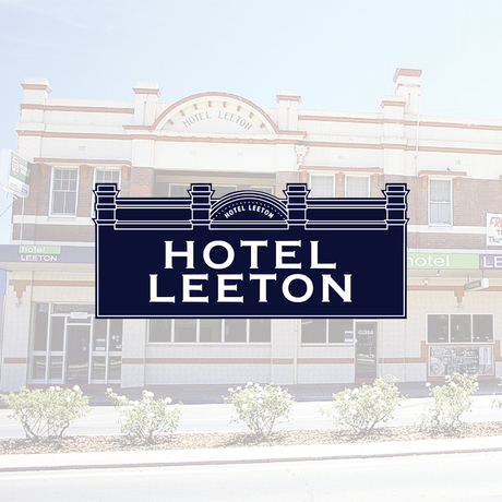 Hotel Leeton sign in front of the hotel building, black and white design.