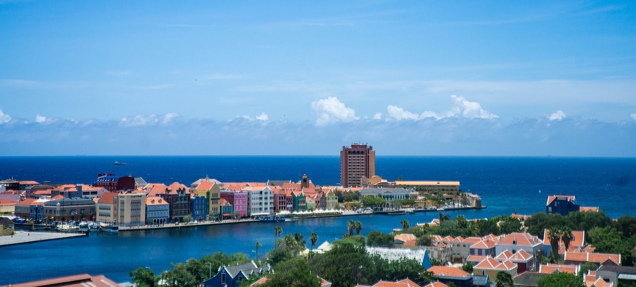 An aerial view of a city next to a body of water.