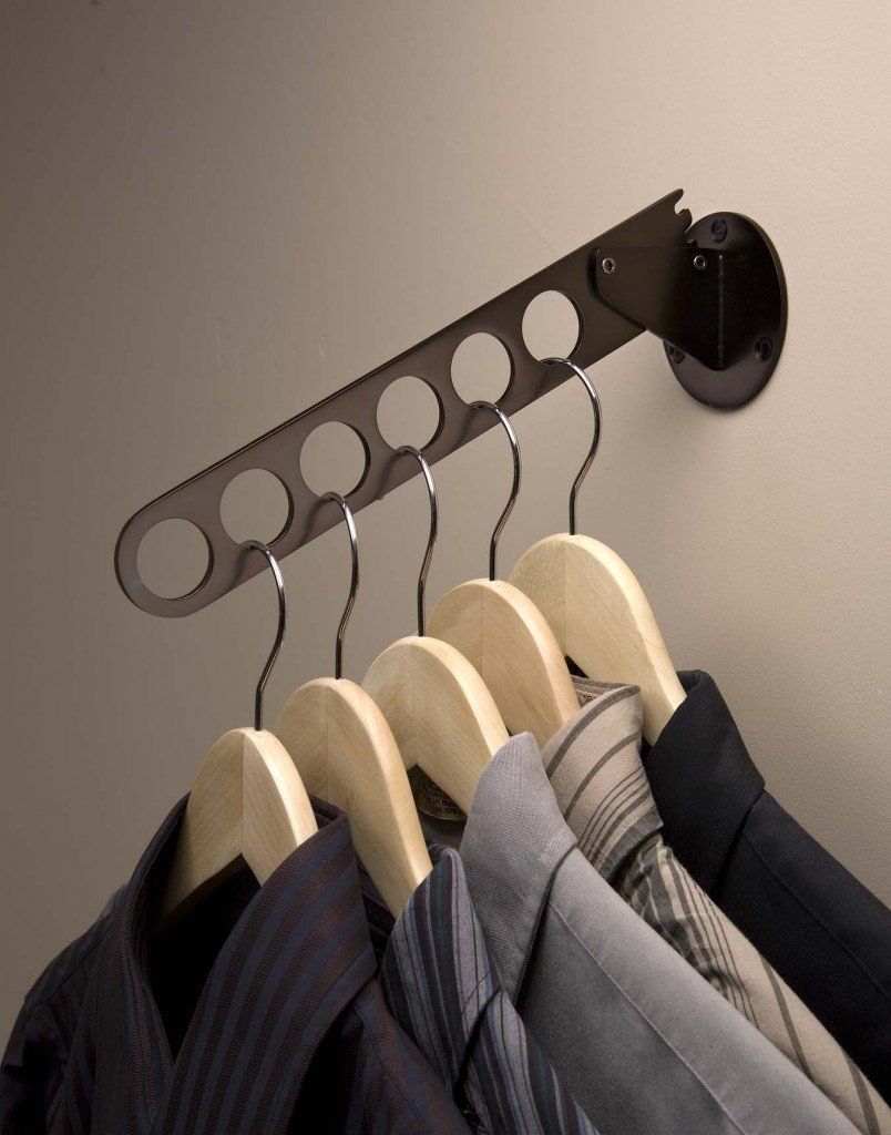 A row of shirts and ties hanging on a rack