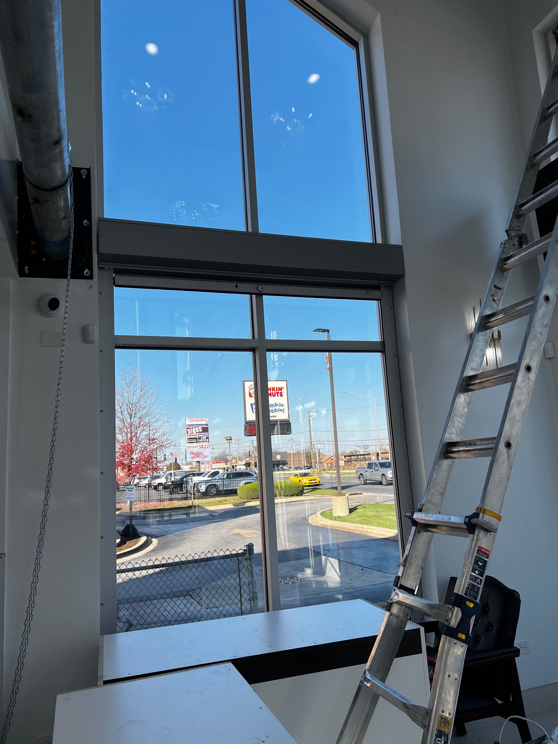 Installing Security Shutter — Chicago, IL — National Shutter System