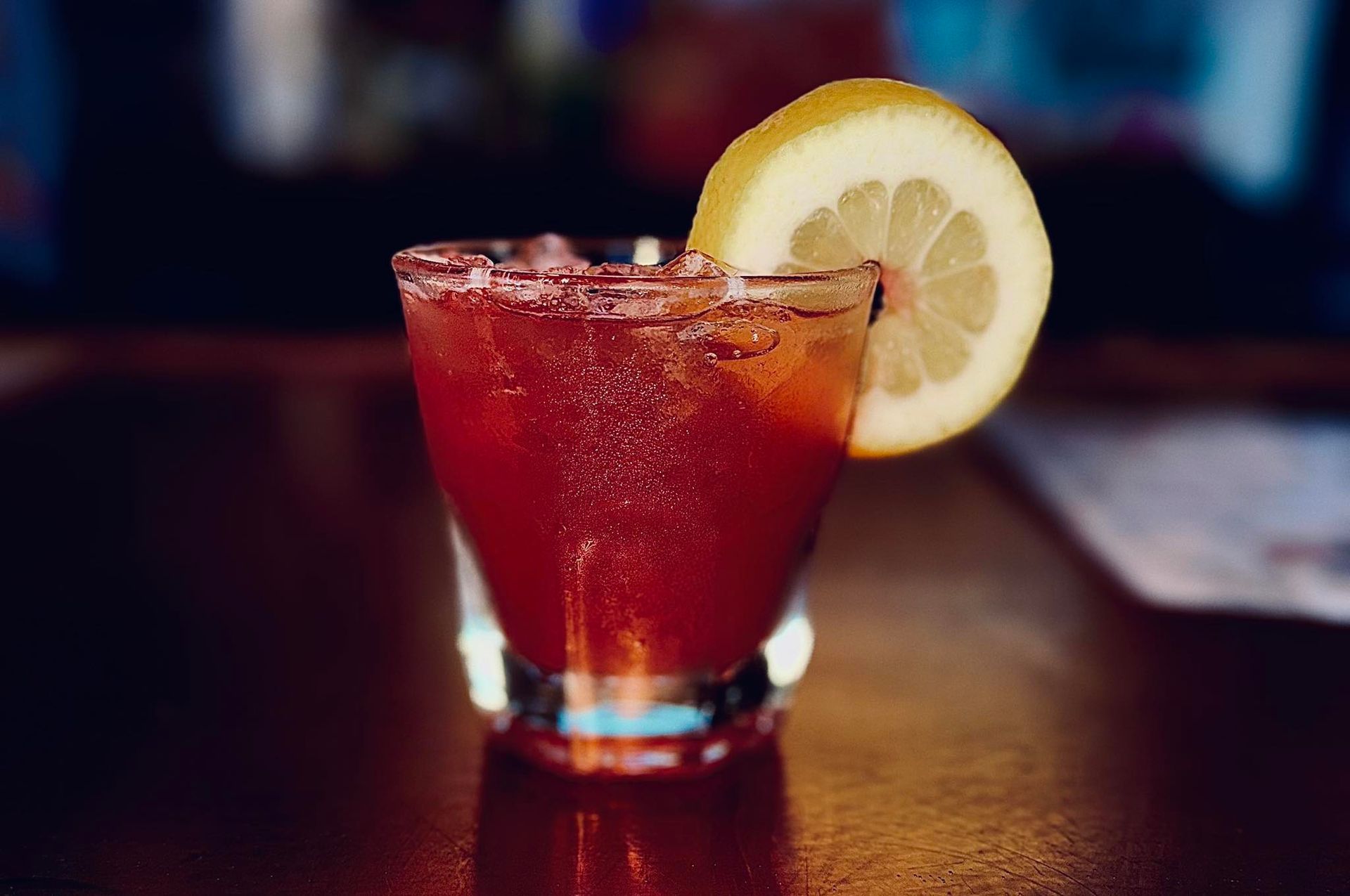 Bloody Mary cocktail in a glass with a lemon slice garnish.
