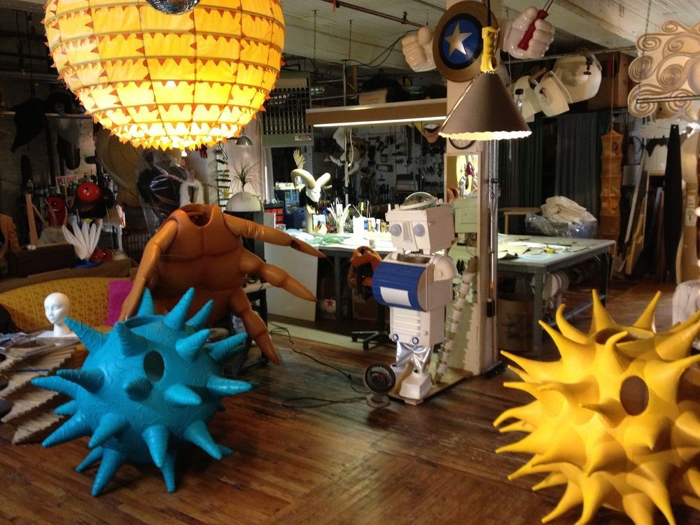 A room filled with lots of sculptures and lamps