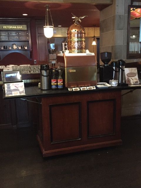 a counter in a restaurant with a fire extinguisher on top of it
