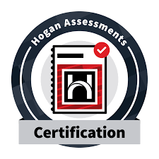 The logo for hogan assessments certification shows a book with a check mark on it.