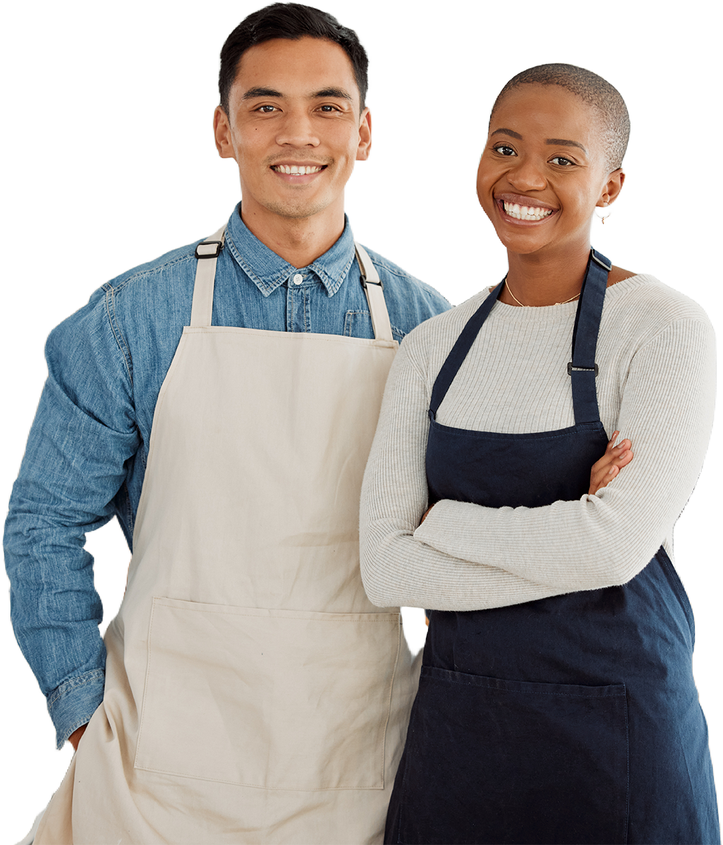 A man and a woman wearing aprons are standing next to each other.