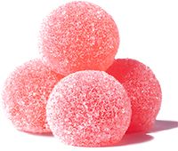 Four pink, sugar-coated round candies stacked on a white background