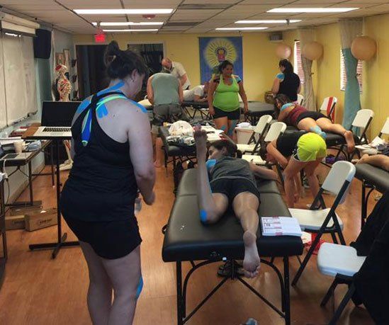 Woman With Back Patches — Winter Park, FL — Central Florida School of Massage Therapy