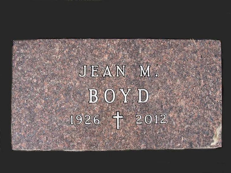 Gravestone reading “Jean M. Boyd 1926 † 2012” on a pink granite marker.