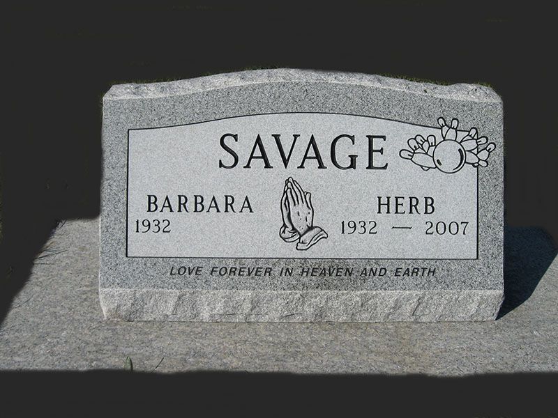 Gray granite memorial headstone for Barbara and Herb Savage with engraved names and dates.