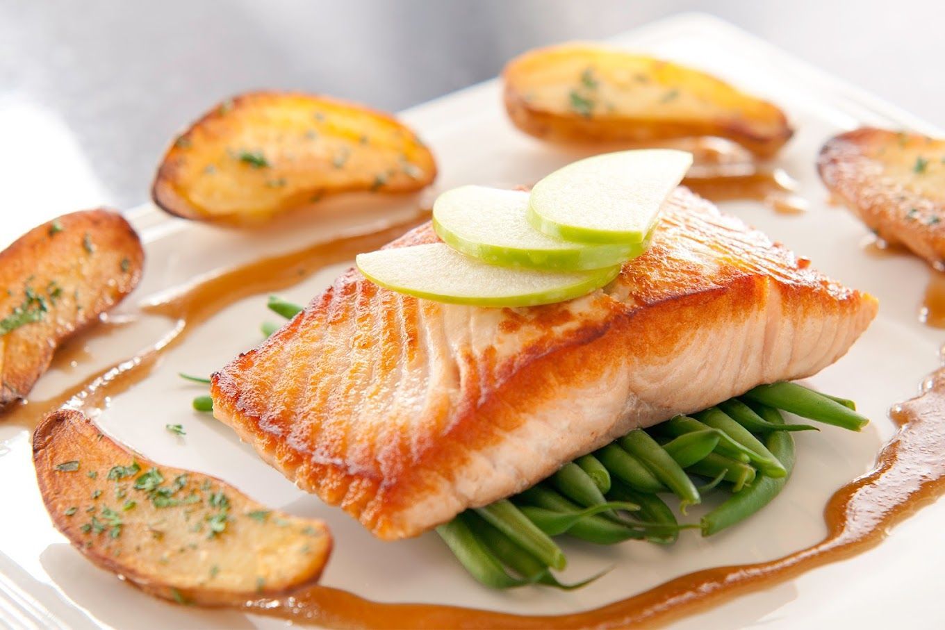 A white plate topped with fish green beans and salmon and potatoes Black Pearl  Restaurant Ann Arbor