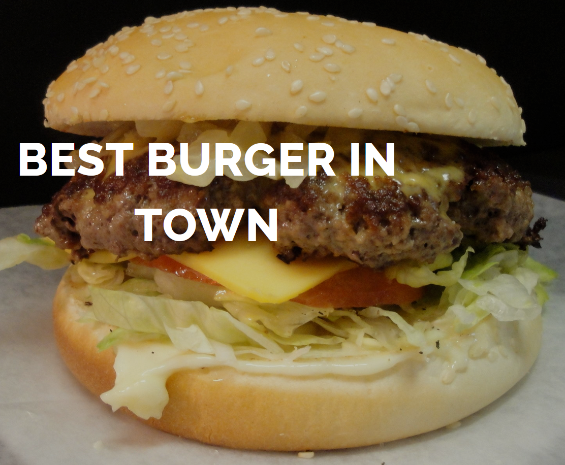 A hamburger with the words best burger in town above it