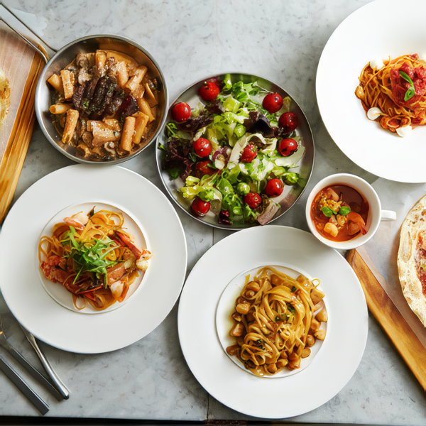 A variety of plates of food are on a table food & drink local restaurants SE Michigan