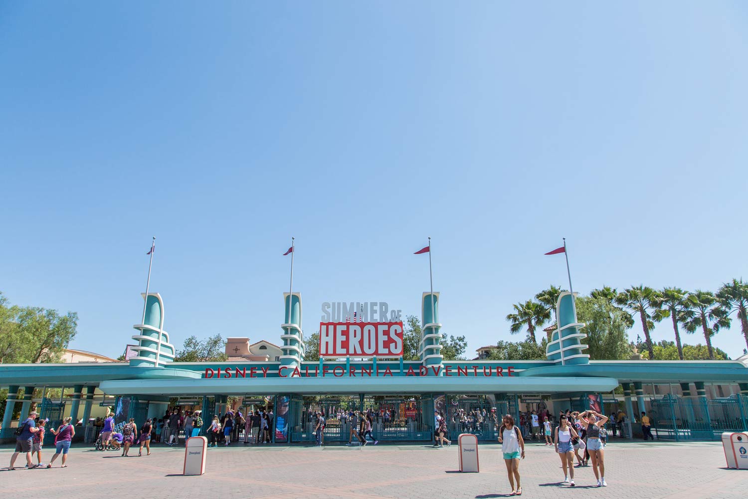 Entrance to Disney’s Hollywood Studios with “The Great Movie Ride” sign and guests under a bright blue sky