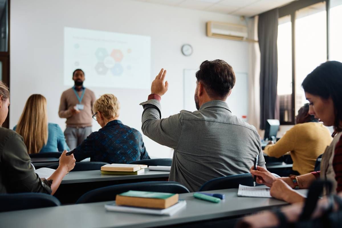 A view from the back of a classroom with adult real estate students at Kentuckiana Real Estate Academy near Lexington, KY