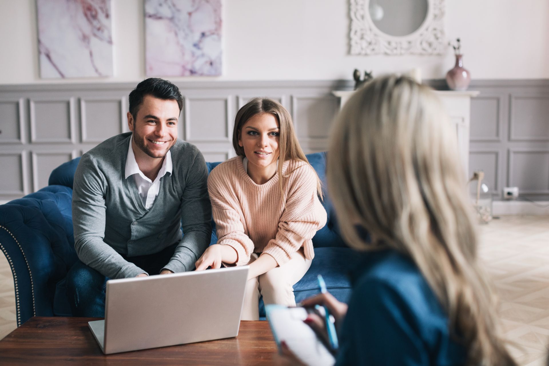 Real estate agent reviewing a settlement statement with clients.