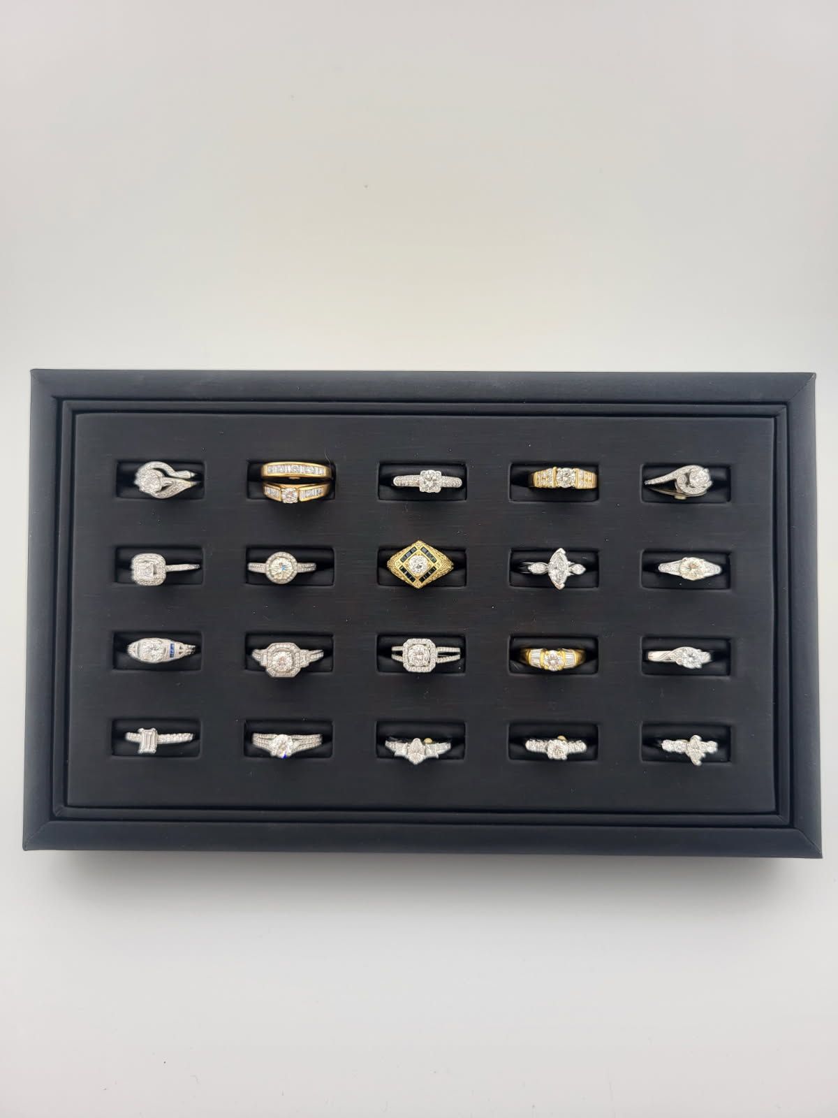 A case showing Engagement Rings & Wedding Bands