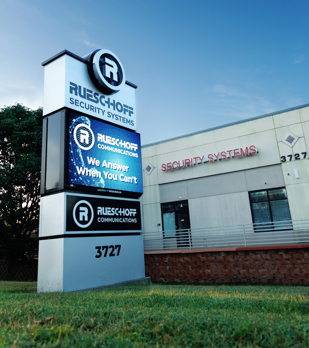 Big exterior sign in front of Rueschhoff Communications building. It says, 