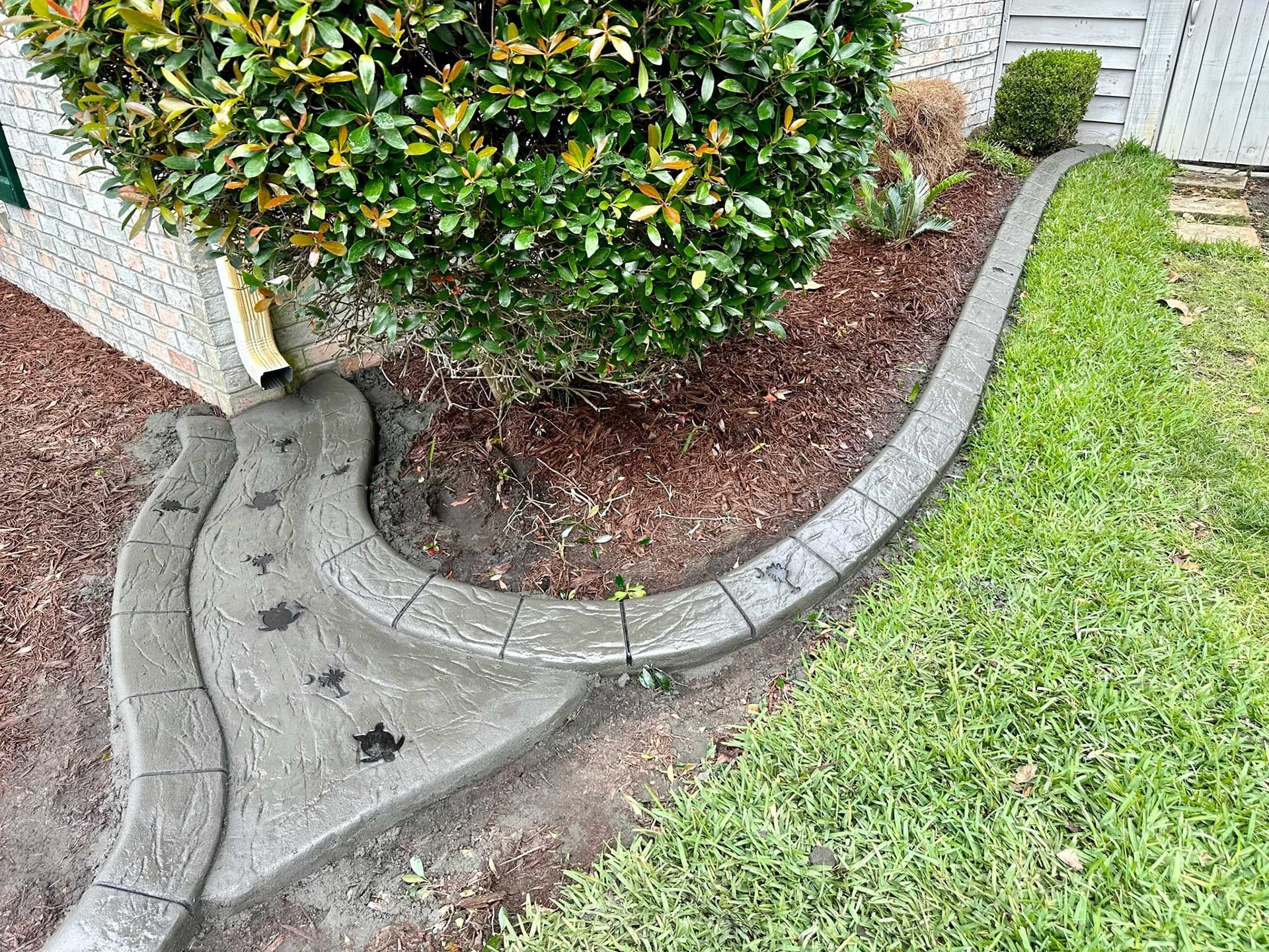 Concrete Curbs Bordering Landscaped Area