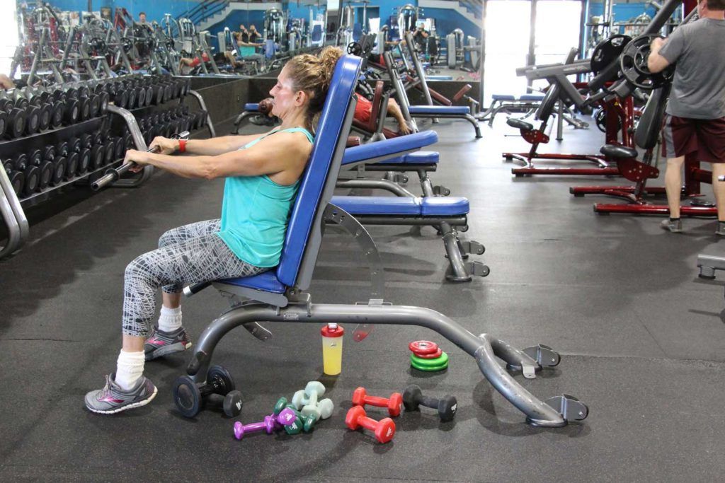 Woman working out in the weight room at Fitness 360 Palm Harbor location