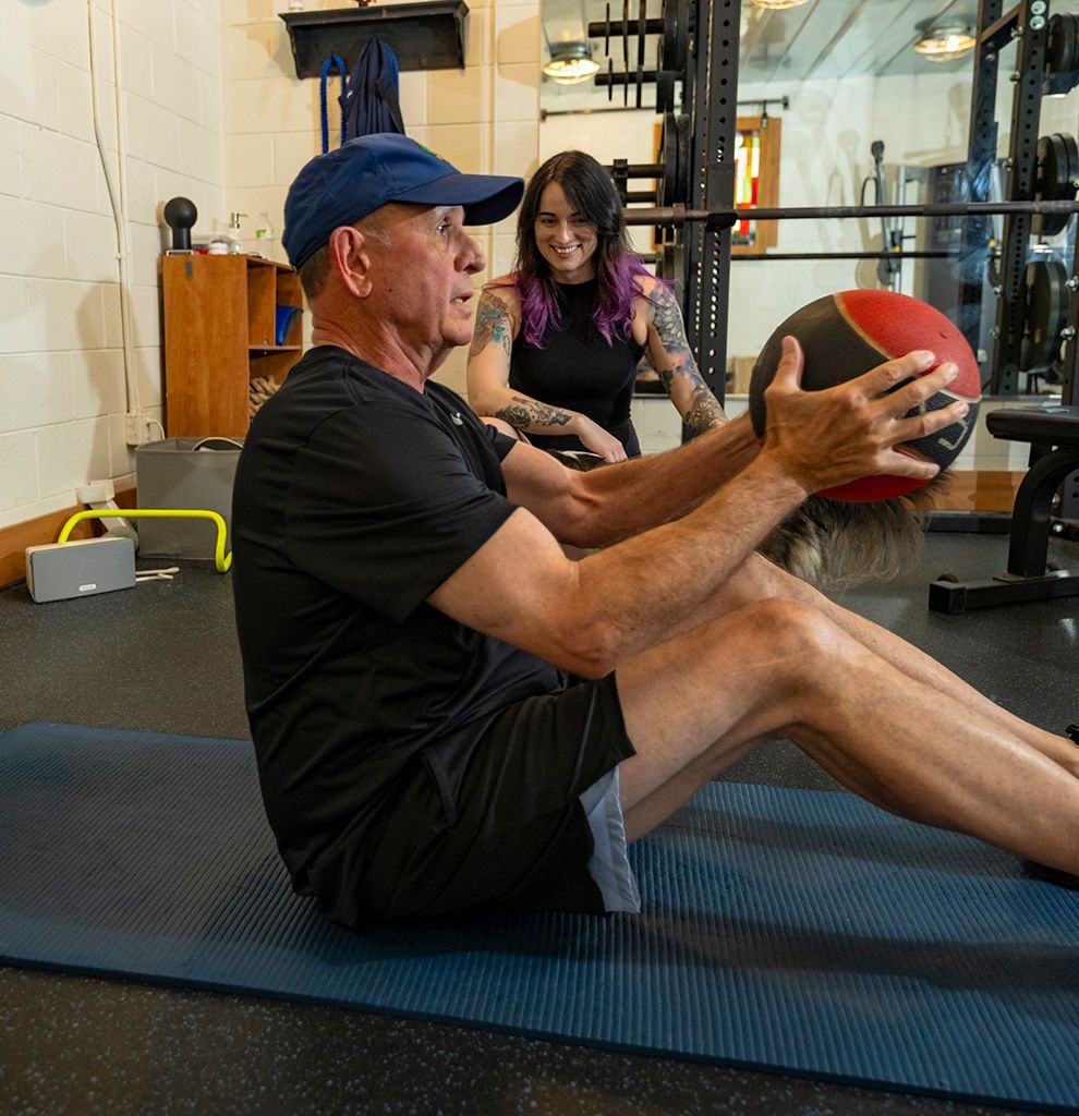 trainer holding a ball