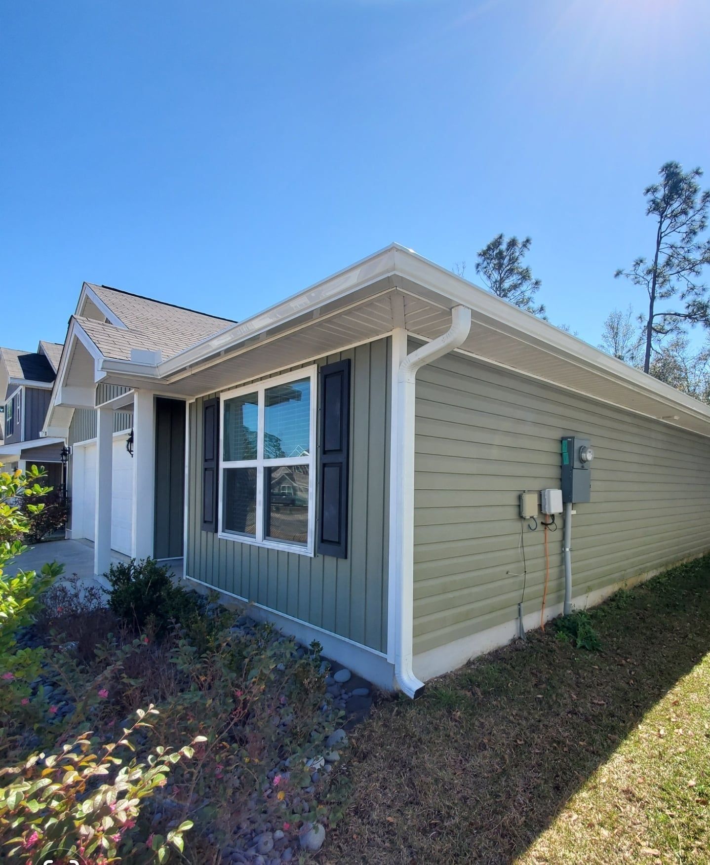 House with new gutter and downspout.