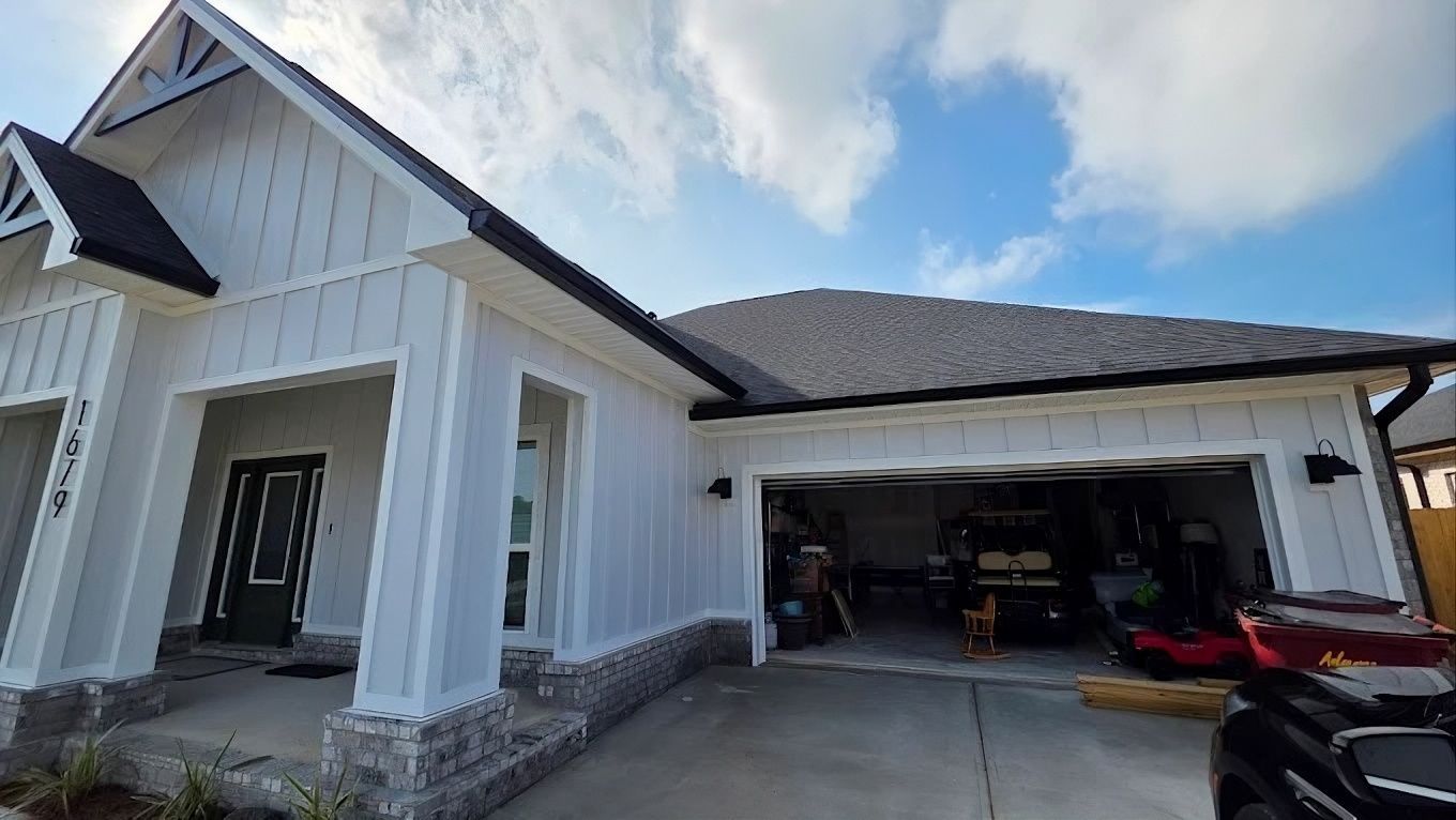 Exterior view of a house with black gutters.