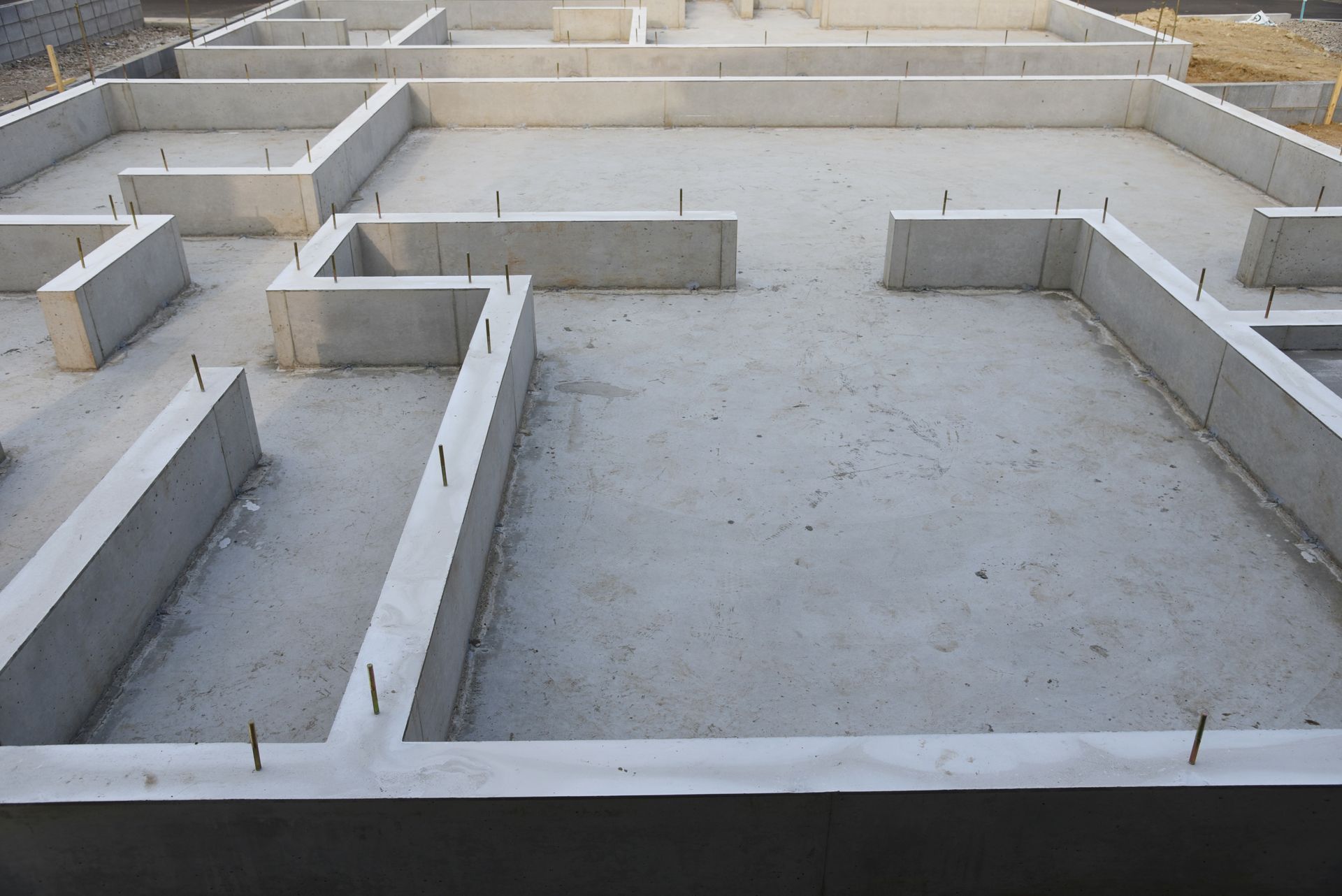 A concrete foundation of a house under construction.