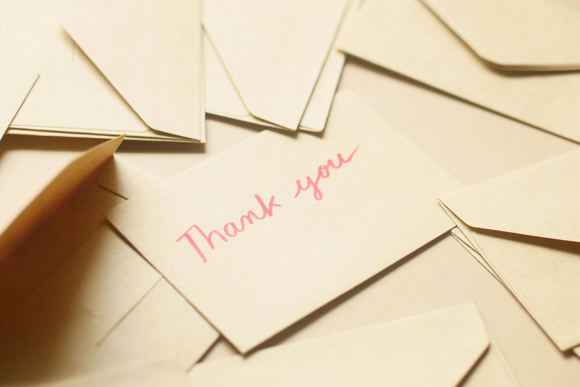 Pile of envelopes with a card that reads
