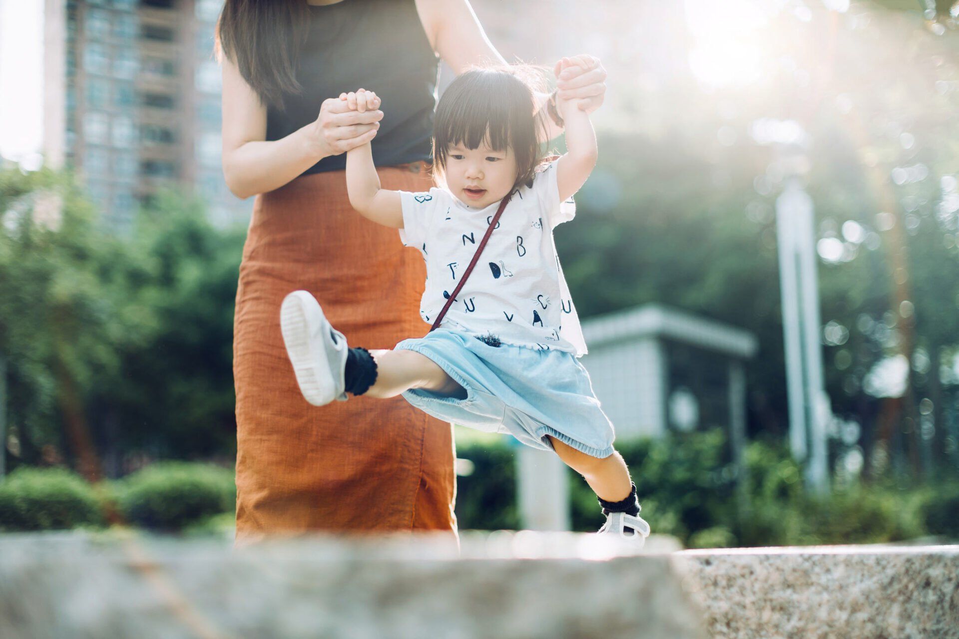 Mother helping child walk — Jacksonville, FL — Beaches Family Law Mother helping child walk — Jacksonville, FL — Beaches Family Law