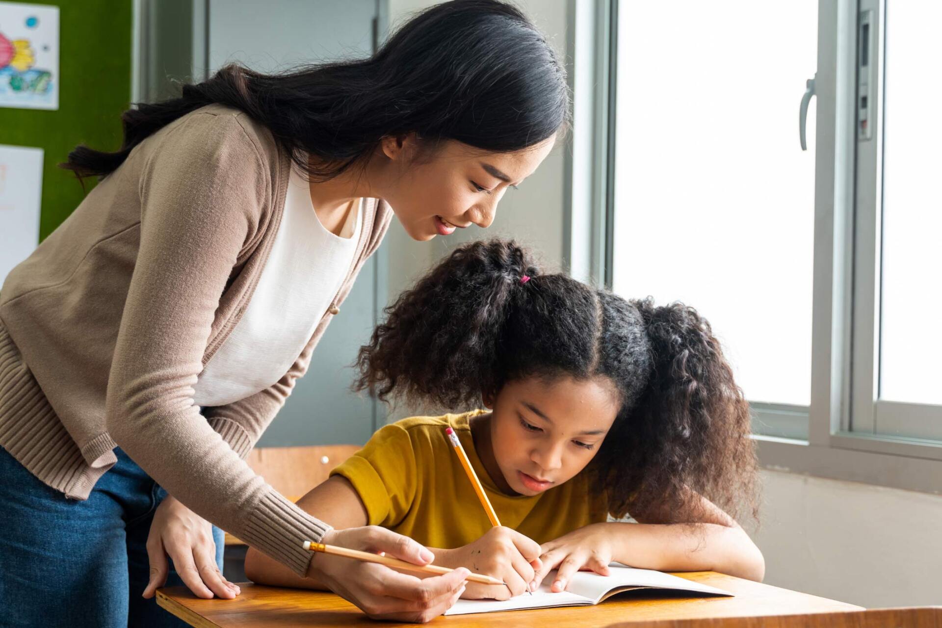 Mother helping child write — Jacksonville, FL — Beaches Family Law Mother helping child write — Jacksonville, FL — Beaches Family Law