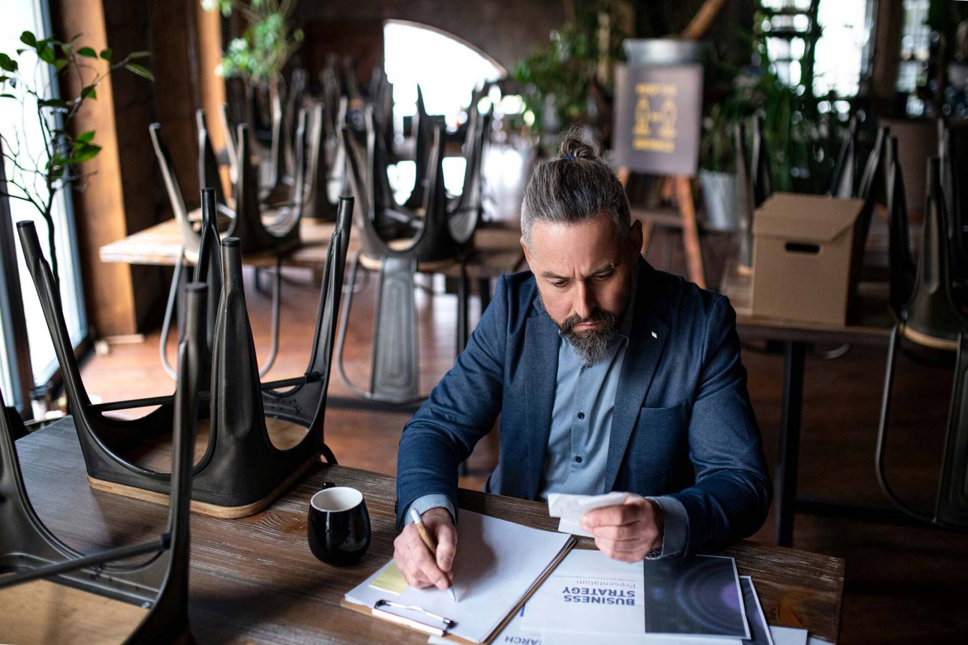 Business man looking at papers — Jacksonville, FL — Beaches Family Law Business man looking at papers — Jacksonville, FL — Beaches Family Law