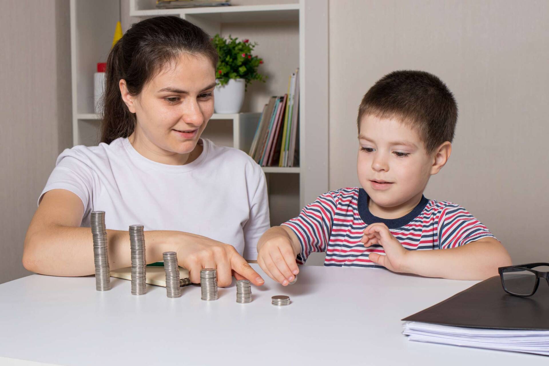 Mother and son stacking coins — Jacksonville, FL — Beaches Family Law Mother and son stacking coins — Jacksonville, FL — Beaches Family Law