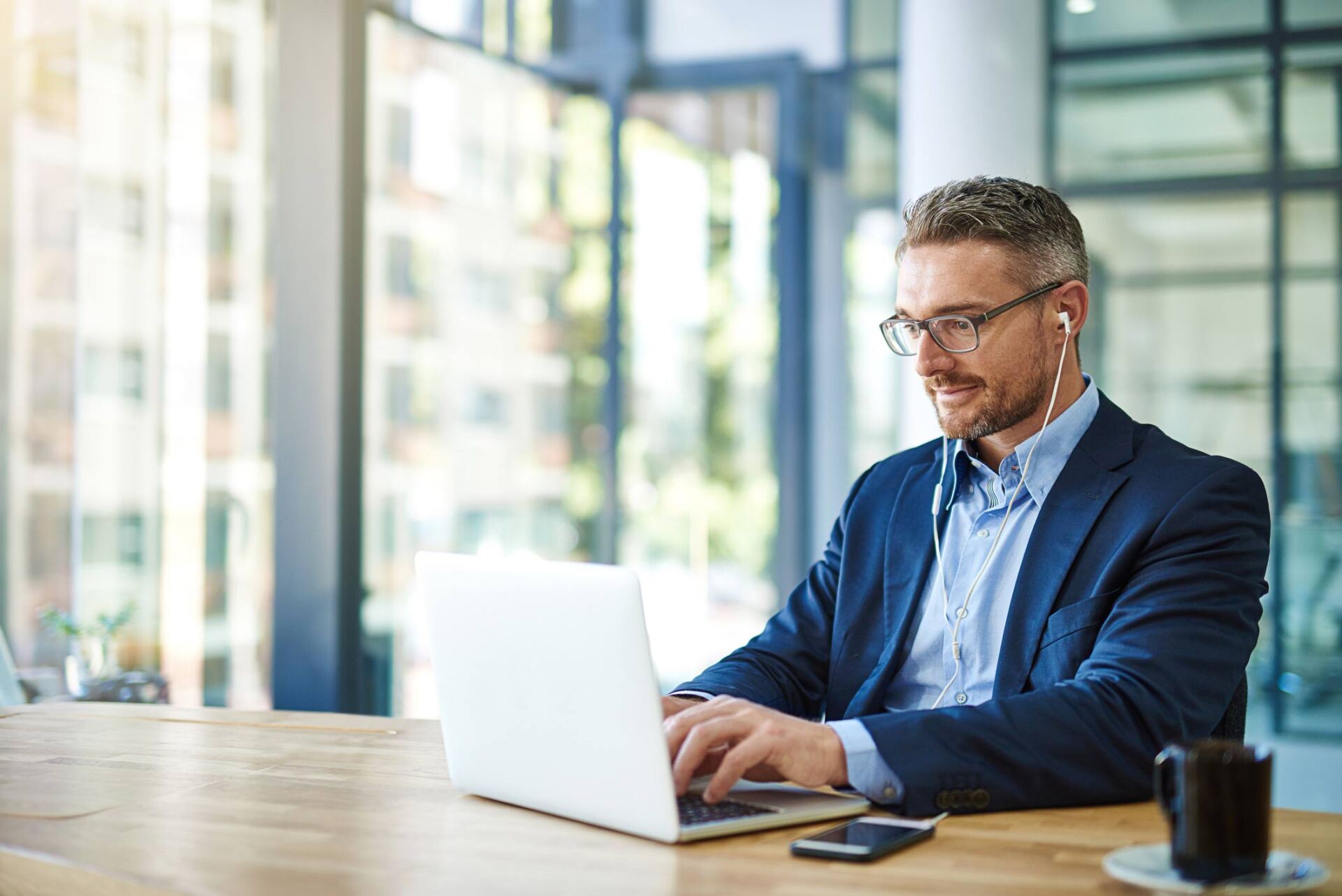 Professional looking man using laptop — Jacksonville, FL — Beaches Family Law Professional looking man using laptop — Jacksonville, FL — Beaches Family Law