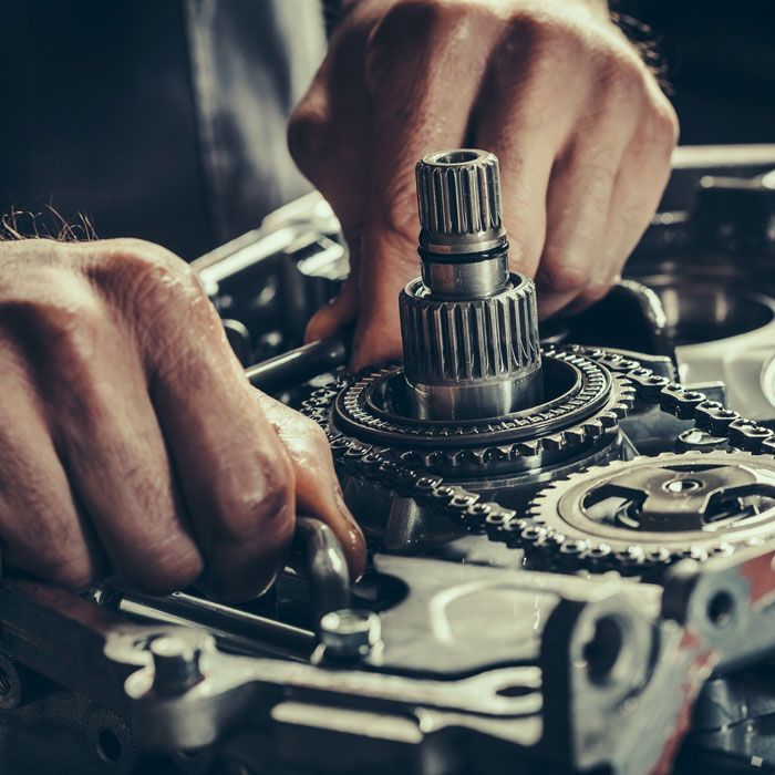 close up of hands turning gears in car