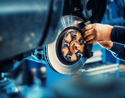 Mechanic inspecting a car