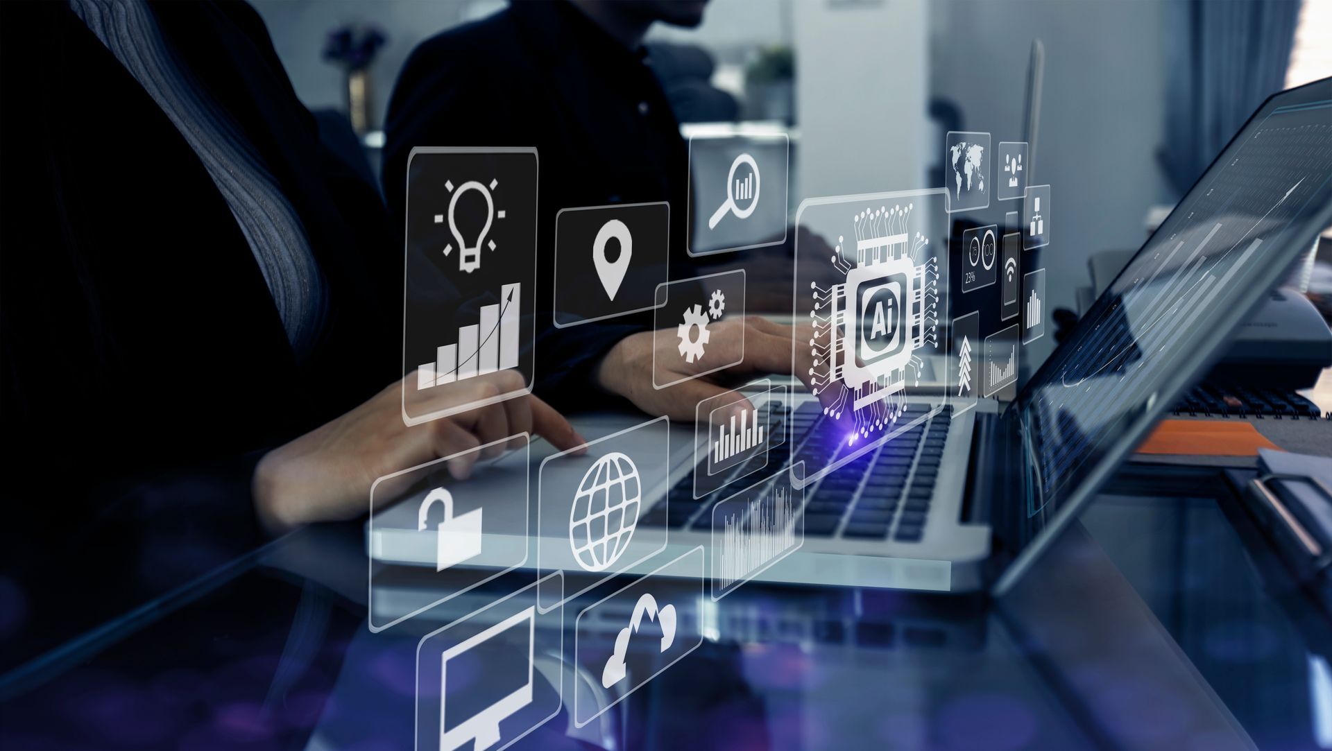 Person using laptop with digital icons overlaid, possibly for data analysis or software development.