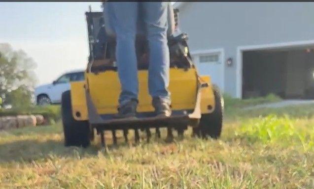 Lawn aeration machine in use | Hackmann Lawn & Landscape |St Charles MO