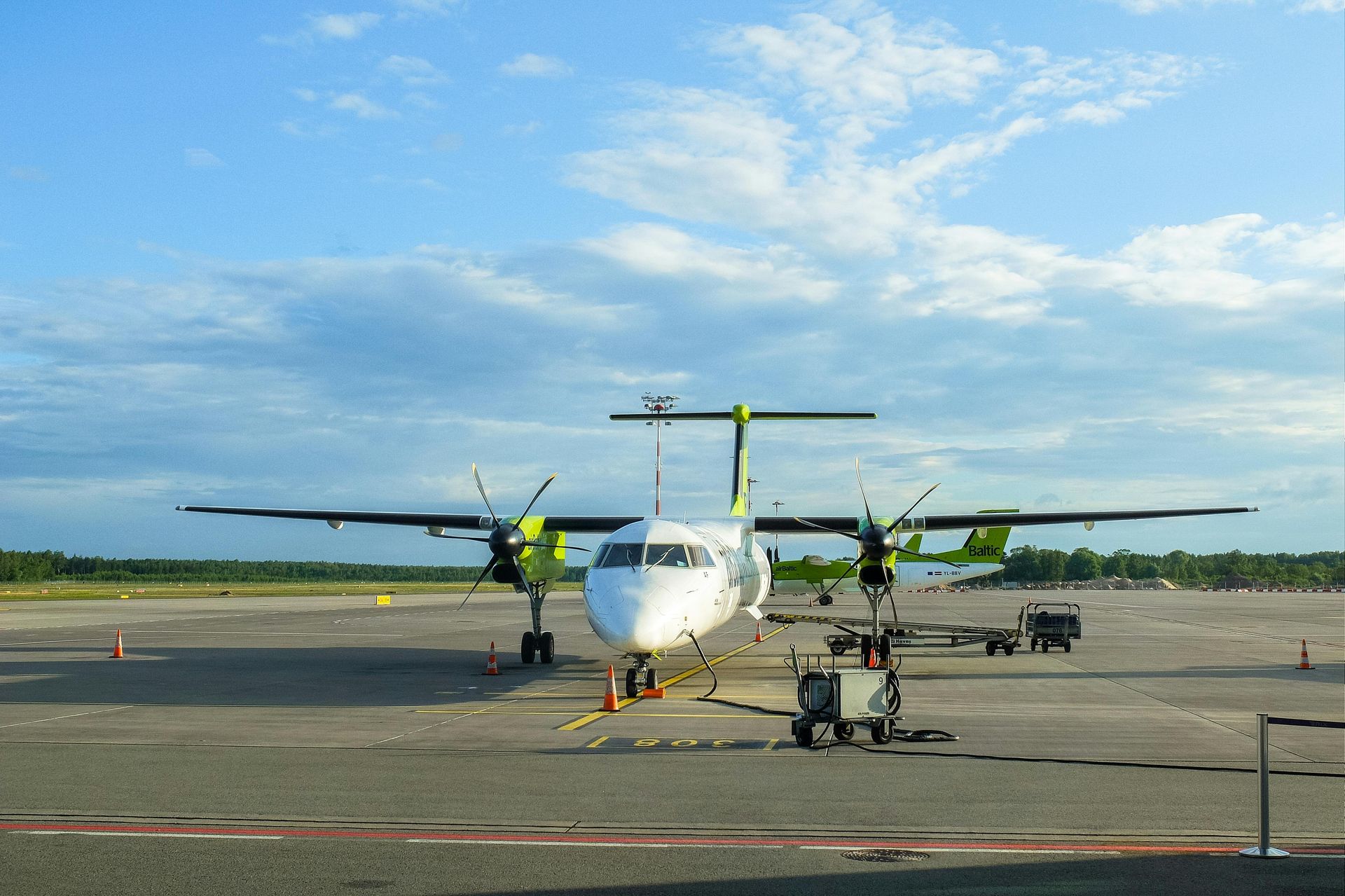 Ground crew coordinating aircraft refueling on the ramp