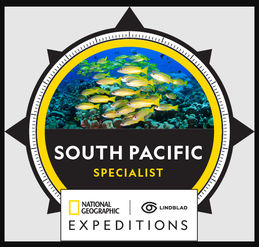 South Pacific Specialist badge. Underwater shot of yellow fish, National Geographic Expeditions and Lindblad logo.
