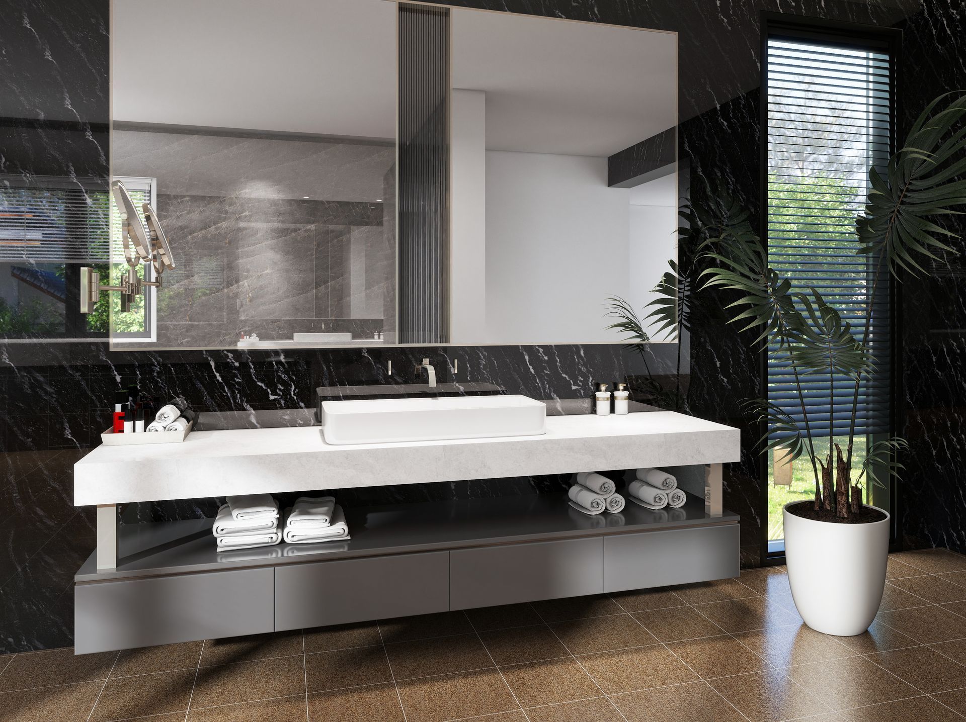 Tocador de baño moderno con espejo grande, lavabo blanco, salpicadero de mármol negro y planta en maceta.
